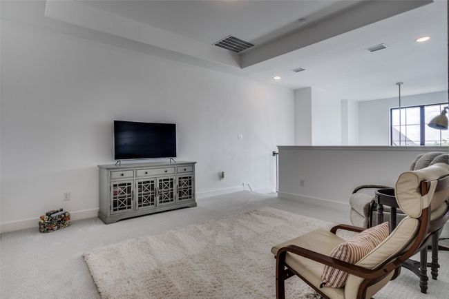 Upstairs Living area featuring carpet flooring, an upstairs landing, and recessed lighting | Image 9