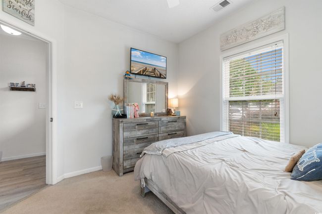 Bedroom featuring baseboards and light carpet | Image 22
