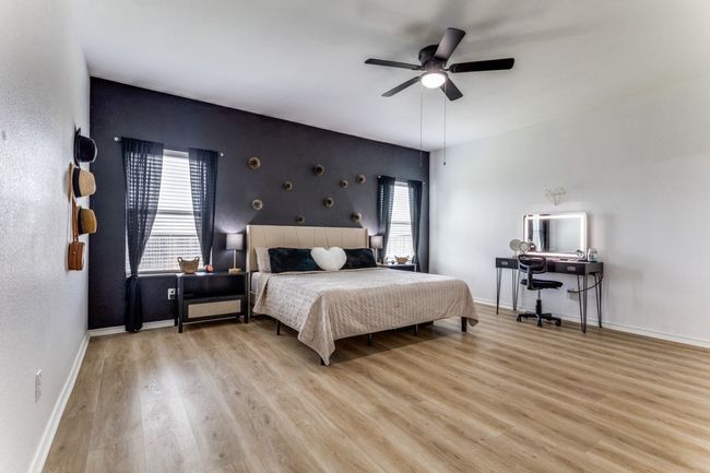 Bedroom featuring wood finished floors and a ceiling fan | Image 22
