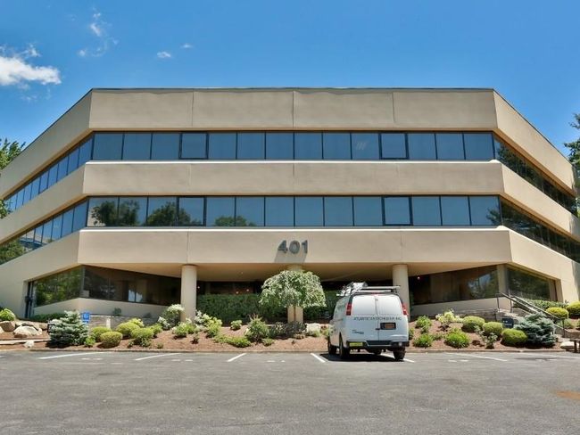View of building exterior featuring parking | Image 10
