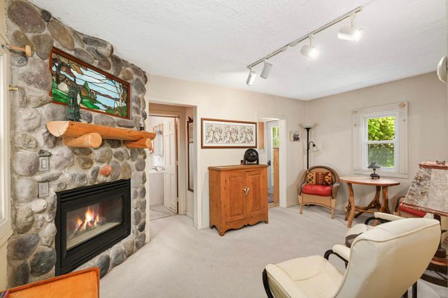 Living room with leather chairs that will stay | Image 6