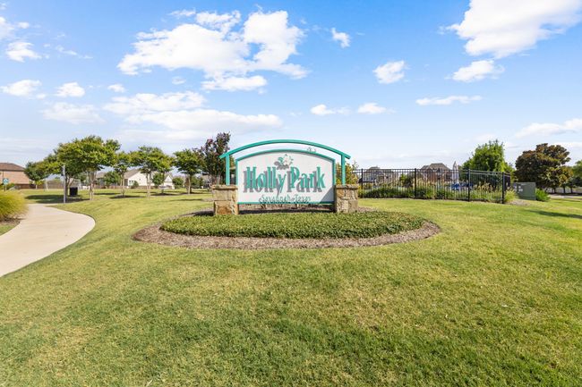Community sign featuring fence and a lawn | Image 32