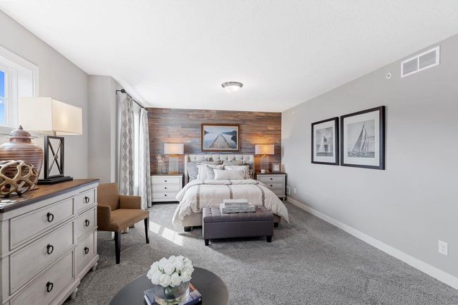 (Photo of a decorated model, actual homes finishes will vary) Spacious, imaginative and modern would best describe the owner's suite. | Image 10