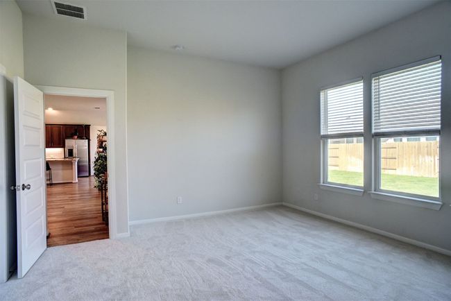 Empty room featuring light carpet, visible vents, and baseboards | Image 21
