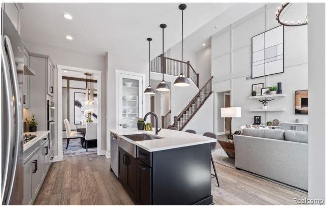 Well appointed kitchen features a large center island | Image 4