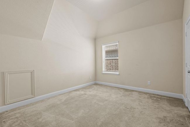 Bonus room featuring carpet floors, baseboards, and lofted ceiling | Image 23