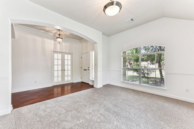 View of front living room with newly installed carpet with lots of natural light | Image 5