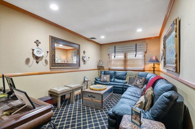 Living room with ornamental molding, carpet flooring, recessed lighting, and visible vents | Image 20