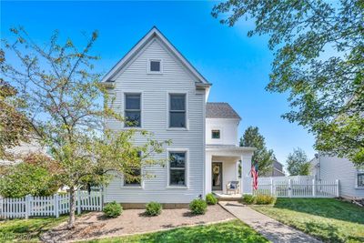 View of front of property with covered porch and a front lawn | Image 1