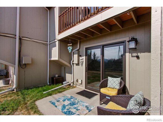 Grill outside on your private patio with ample space for seating. | Image 24