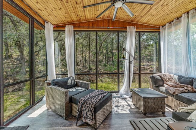 Sunroom / solarium featuring outdoor lounge area and ceiling fan | Image 8