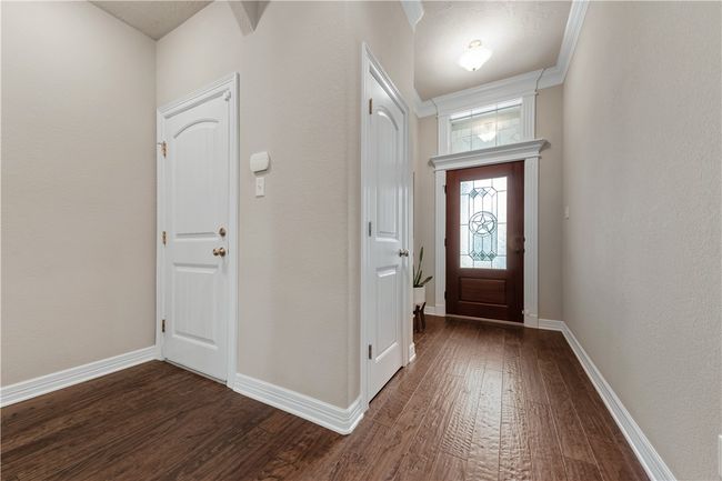 Foyer entrance featuring dark wood-style floors and baseboards | Image 29