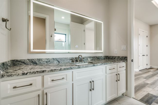 Bathroom featuring wood-type flooring and vanity | Image 24