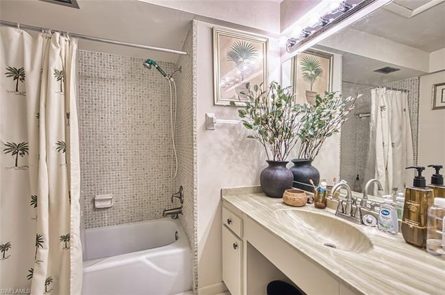 Full bathroom featuring vanity and shower / tub combo | Image 26