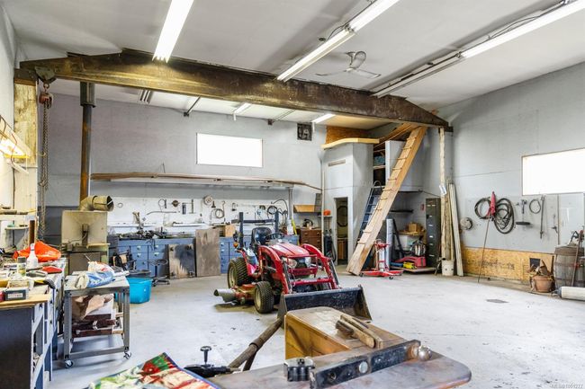 Garage featuring a workshop area | Image 40