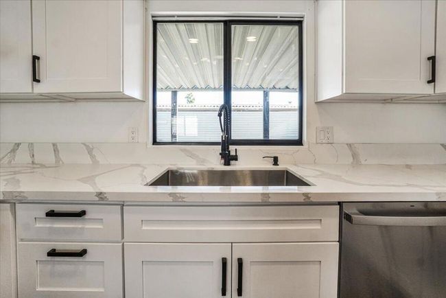 New sink with view of patio | Image 25