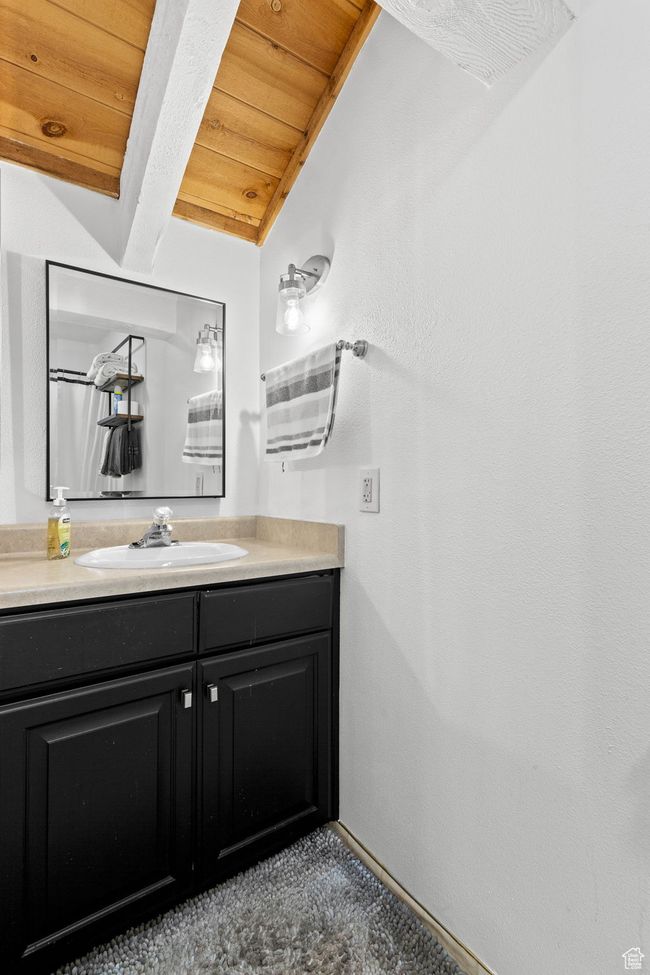 Bathroom featuring wooden ceiling and vanity | Image 16