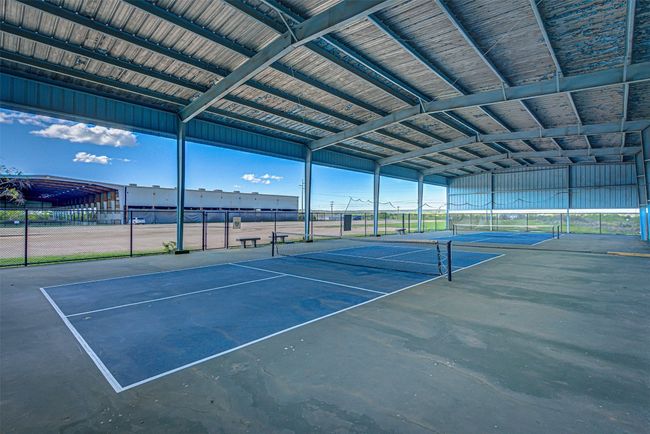 Covered basketball courts near some tennis courts | Image 21