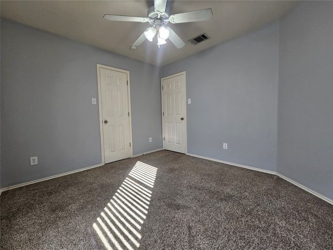 Unfurnished room with carpet flooring and ceiling fan | Image 21
