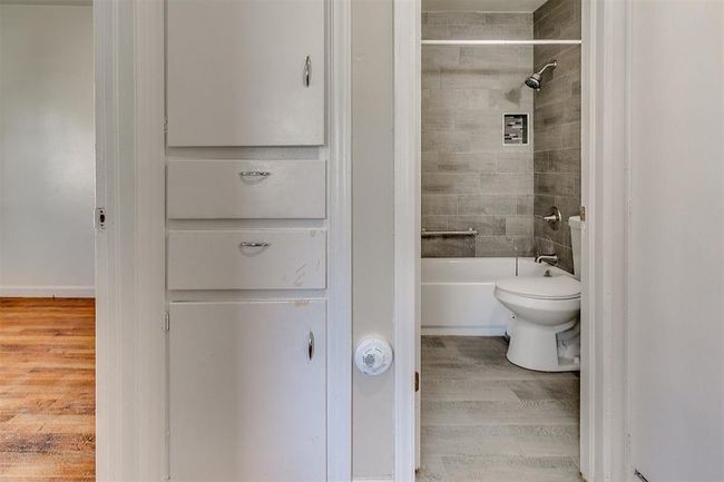 Linen closet outside of bathroom. | Image 13
