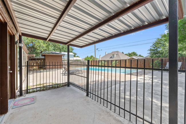 Back patio with fenced pool area | Image 30
