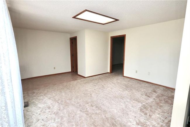 Unfurnished room featuring carpet floors and baseboards | Image 23