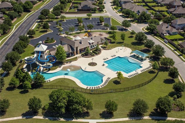 Enjoy a large pool and water park within this community. | Image 14