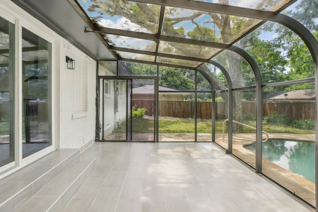 View of unfurnished sunroom | Image 36