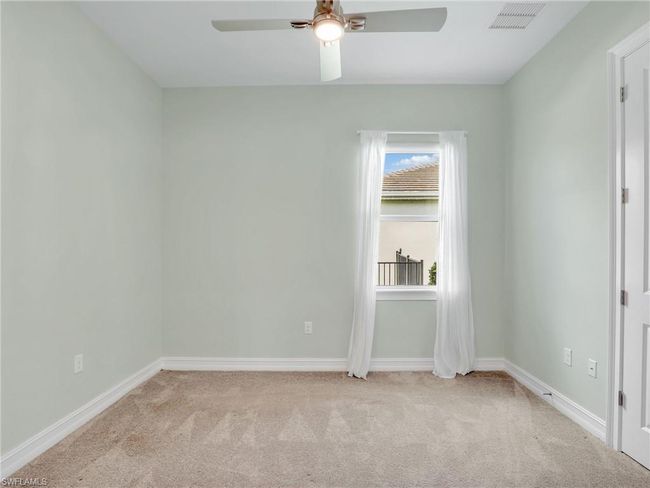 Carpeted empty room with ceiling fan | Image 26