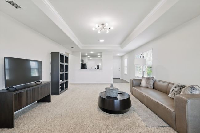 Living Room and Dining Room featuring the Kitchen Breakfast Bar | Image 10