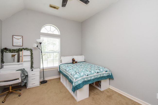 Bedroom #4, measuring 12' x 12' is perfect for a growing child and also comes well-packaged with a big window, ceiling fan and walk-in closet. Exciting news: Seller is offering $5K credit to replace the carpet to what you desire for the home. | Image 27