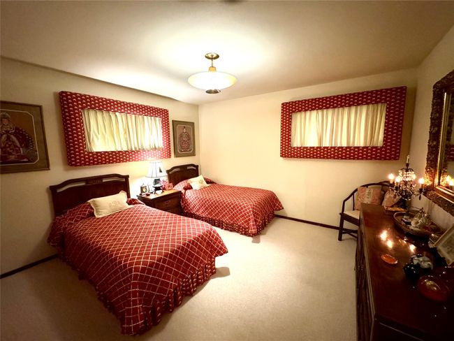 Carpeted bedroom featuring baseboards | Image 34
