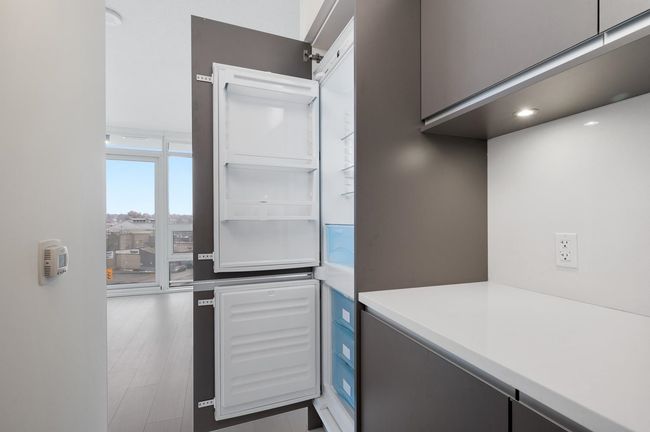 Kitchen with light countertops | Image 9