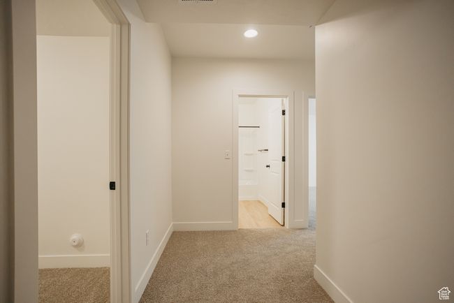 Corridor featuring light carpet | Image 29