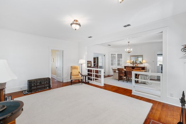 Living area with wood finished floors | Image 7