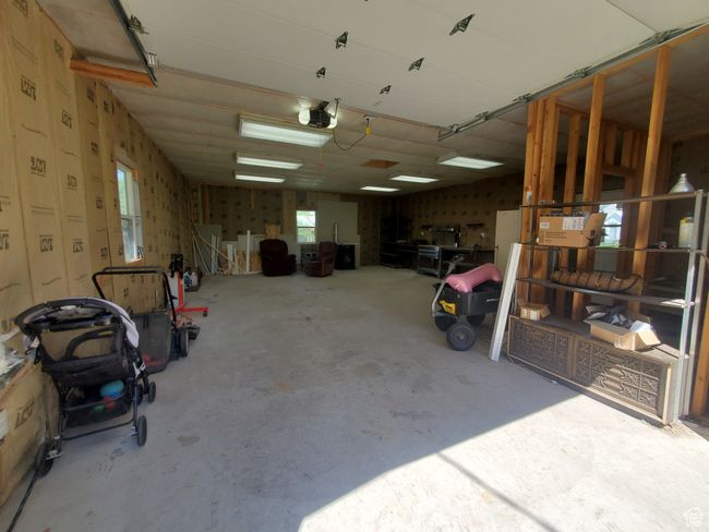 Garage with a garage door opener | Image 16
