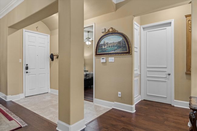 Entrance foyer featuring wood finished floors, baseboards, and a ceiling fan | Image 9