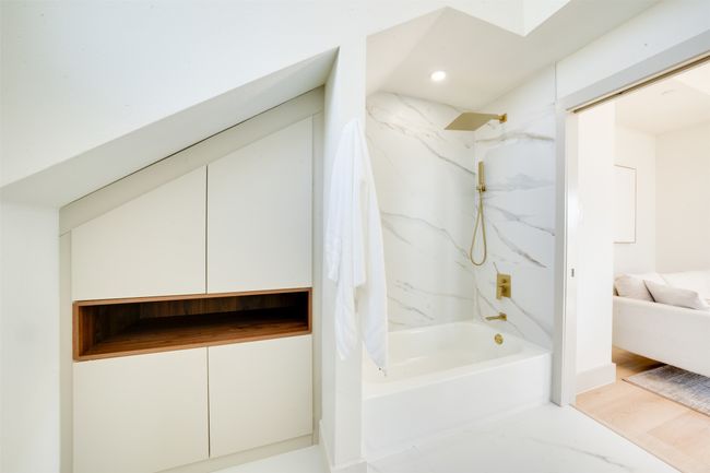 Bathroom featuring tiled shower / bath and wood-type flooring | Image 35
