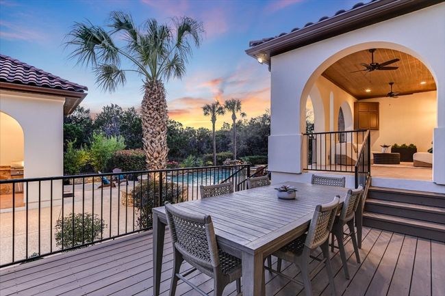 Deck at dusk featuring outdoor dining space | Image 18