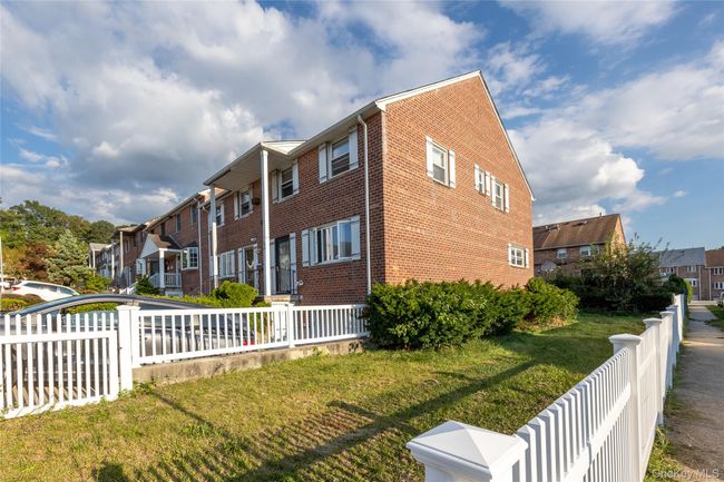 View of home's exterior featuring a residential view and brick siding | Image 23