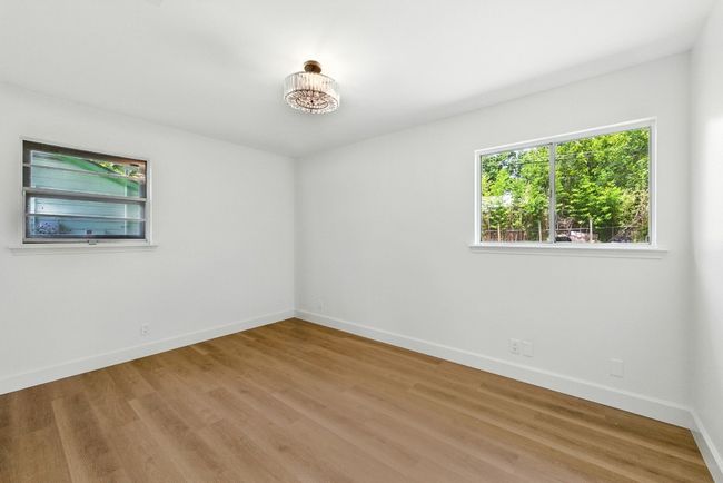 Spare room with wood finished floors | Image 17