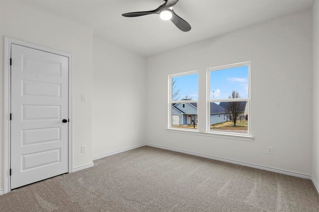 Carpeted empty room with ceiling fan | Image 25