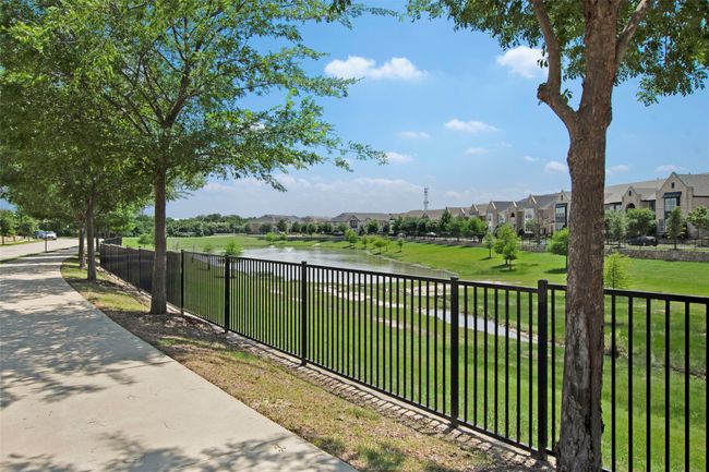 View of yard with a residential view and a water view | Image 31