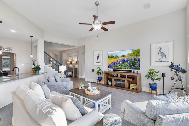 Soaring ceilings elevate the sense of space and elegance, filling this inviting home with light and style. | Image 13