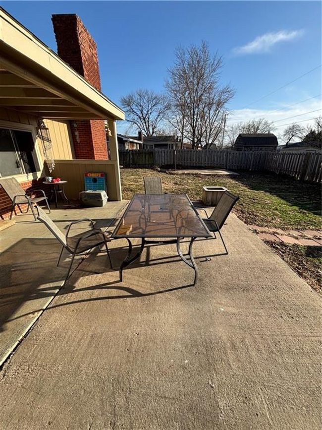 View of patio / terrace featuring a fenced backyard and outdoor dining space | Image 28