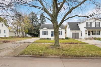 View of front of house featuring a front yard and a garage | Image 2