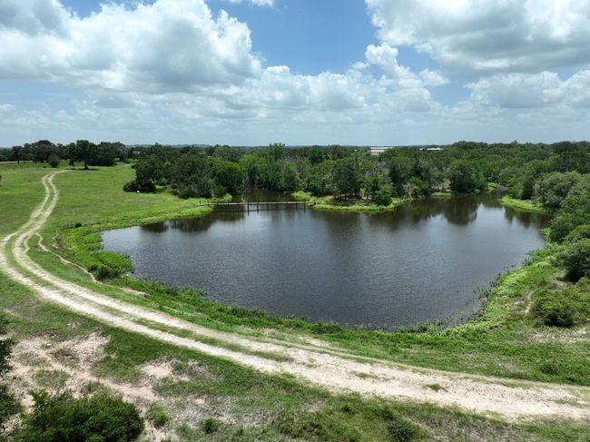 Water view with a heavily wooded area | Image 5