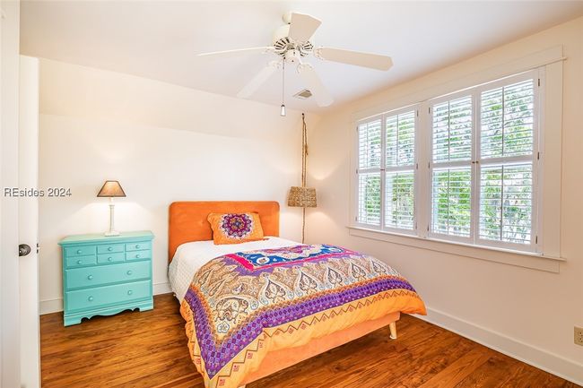 Bedroom with ceiling fan and dark hardwood / wood-style floors | Image 40
