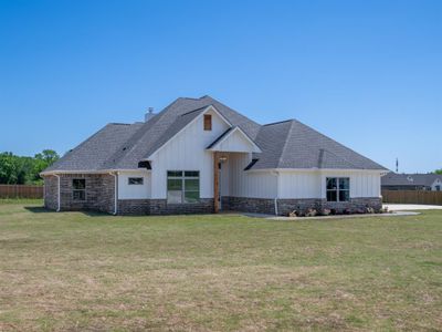 Modern farmhouse style home with a front lawn | Image 2