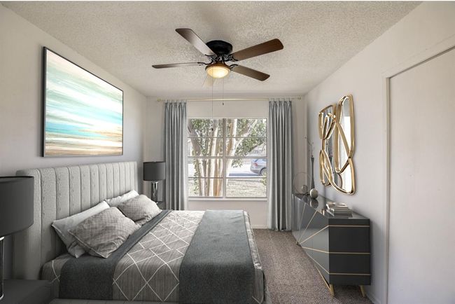 Another view of primary bedroom with different furniture set up. | Image 17